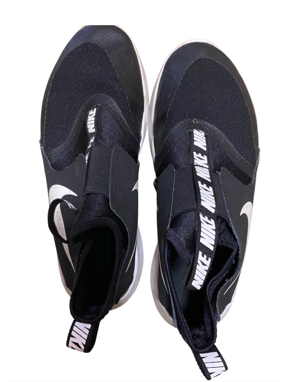 Nike • Flex Runner • Black and White Slip-On Sneakers